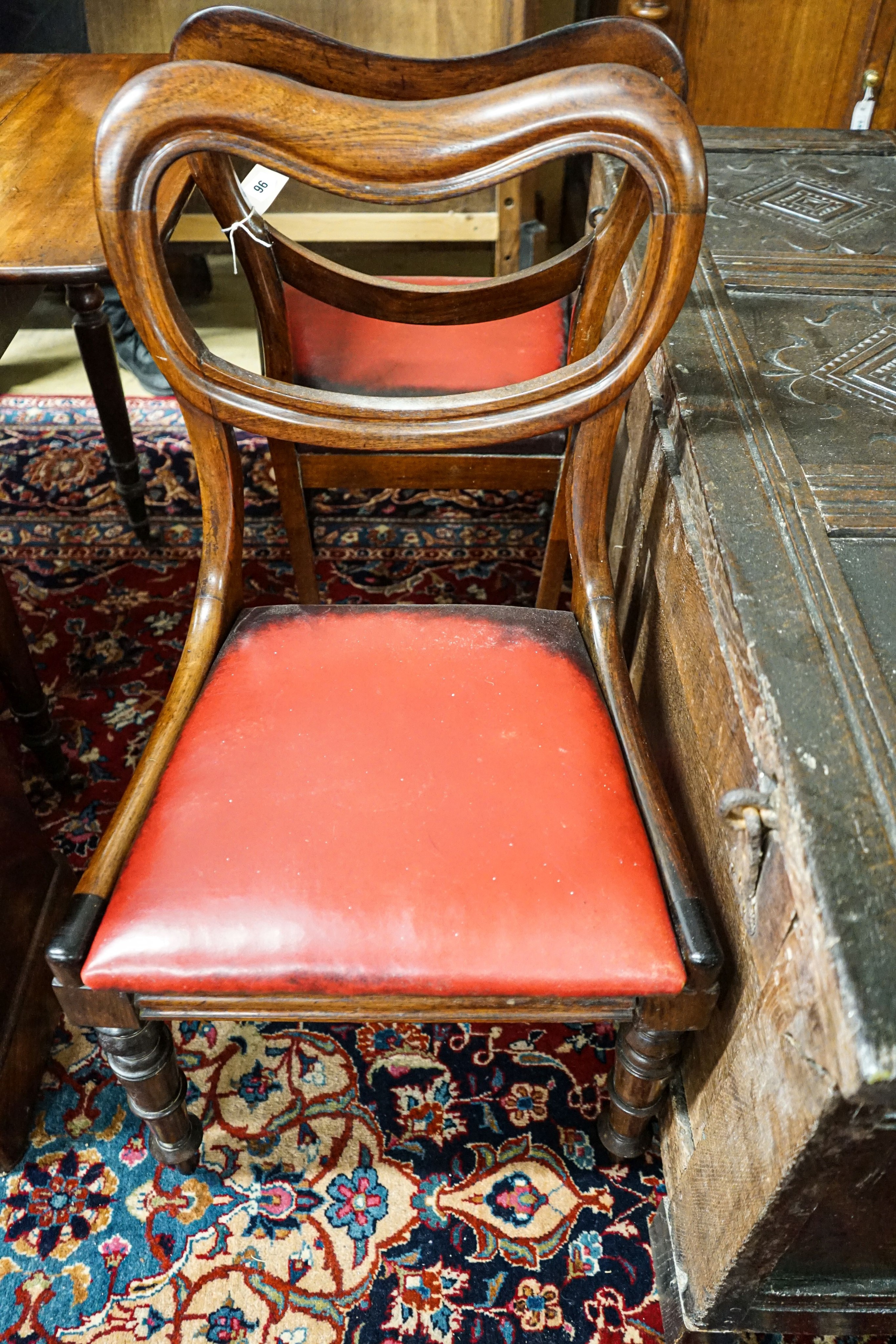 A Victorian mahogany commode cupboard with grey marble top, width 93cm, depth 36cm, height 75cm together with a pair of Victorian rosewood kidney back dining chairs